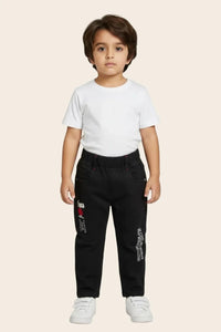 Young boy wearing classic straight denim jeans from Denimden Boys Collection, suitable for ages 1 to 4 years.